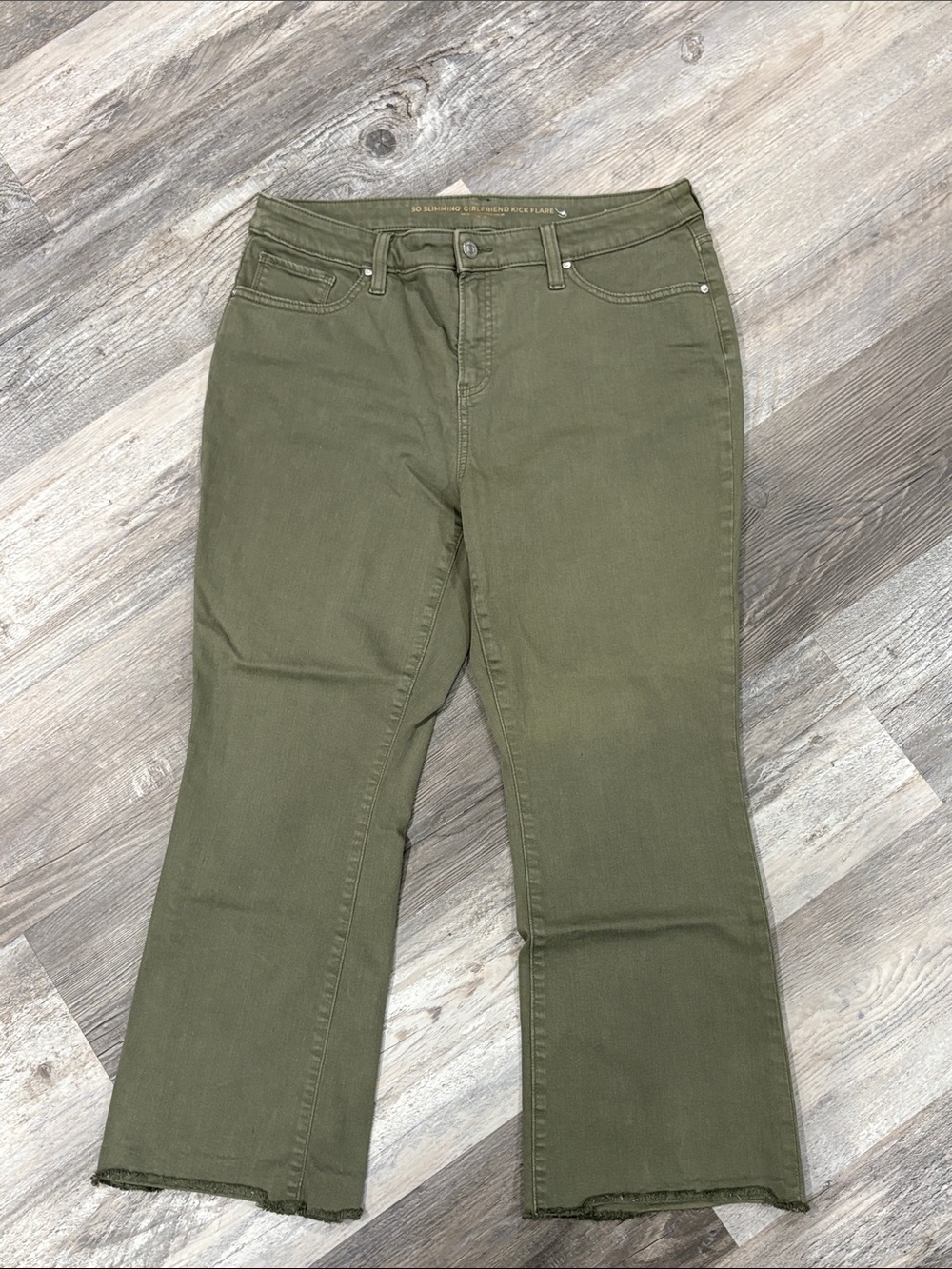 Chico's So Slimming Girlfriend Kick Flare Jeans in a khaki/olive green
